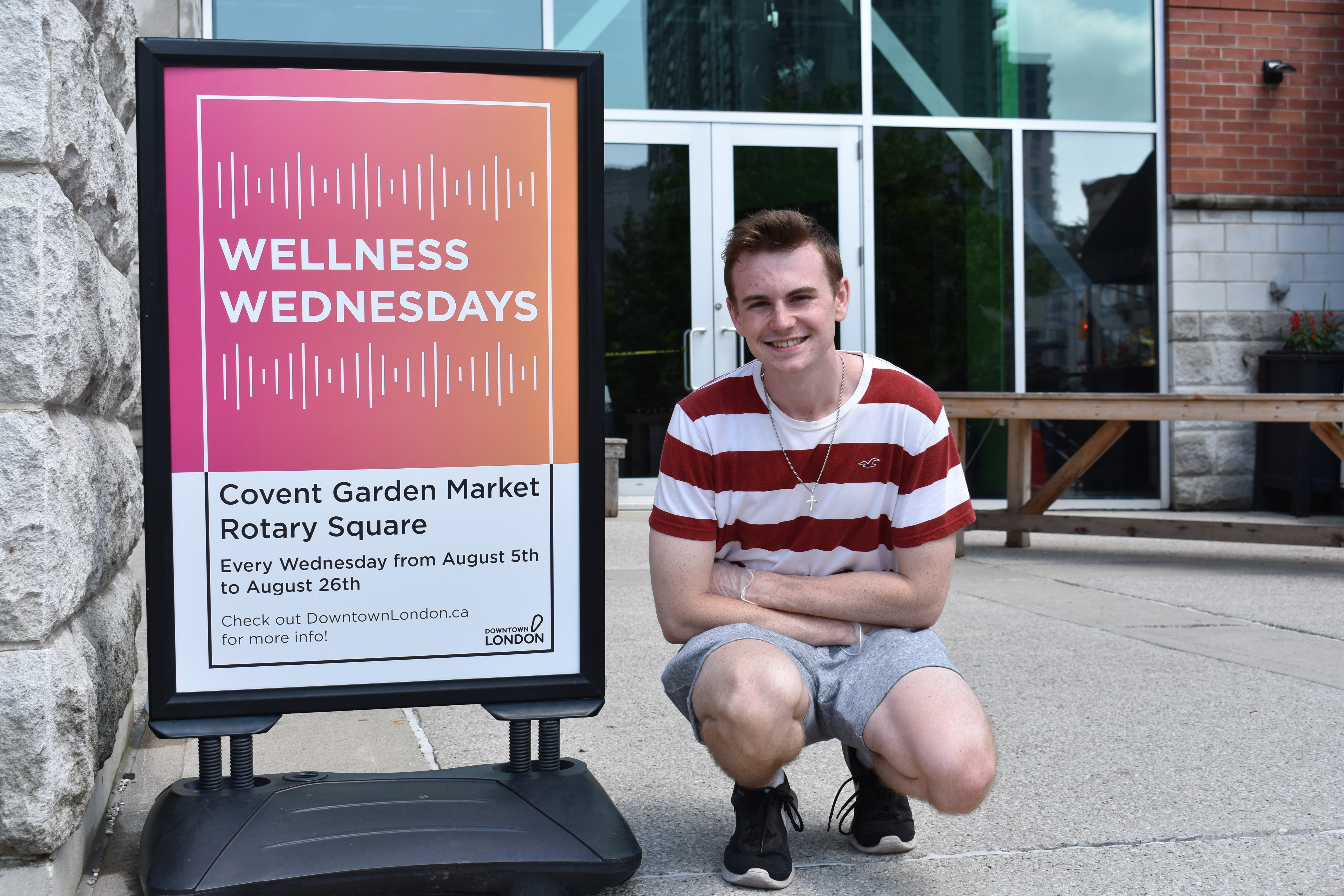 photo of me with my printed Wellness Wednesday A Frame Design