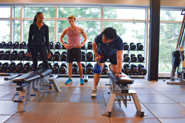 Trainer demonstrating exercise to group at the fitness centre at the Paramount Fine Foods Centre