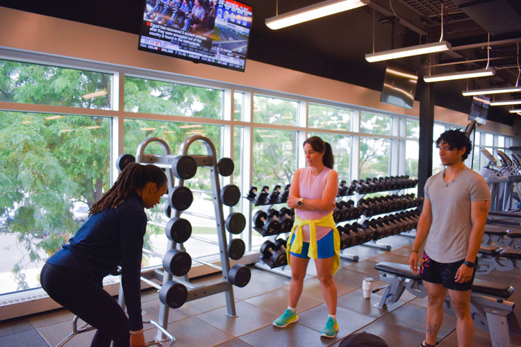 Trainer demonstrating exercise to group at the fitness centre at the Paramount Fine Foods Centre