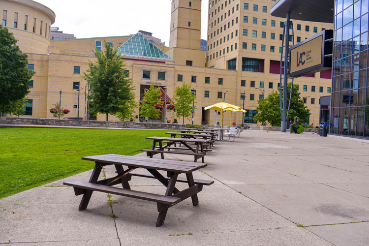 picnic tables at the Living Arts Centre across from Civic Centre